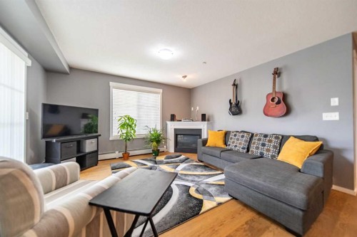4318-99 Copperstone Park Se, Calgary, AB - Indoor Photo Showing Living Room With Fireplace