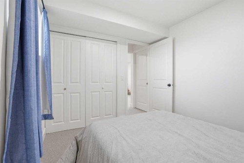 437 Maplewood Se, Diamond Valley, AB - Indoor Photo Showing Bedroom