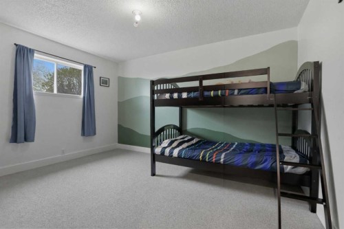 437 Maplewood Se, Diamond Valley, AB - Indoor Photo Showing Bedroom