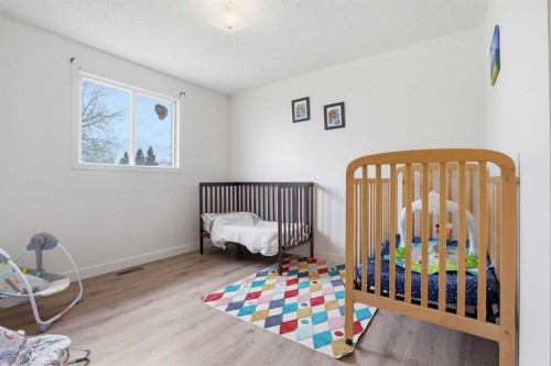 437 Maplewood Se, Diamond Valley, AB - Indoor Photo Showing Bedroom