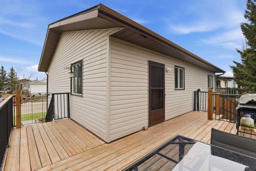 437 Maplewood Se, Diamond Valley, AB - Outdoor With Deck Patio Veranda With Exterior