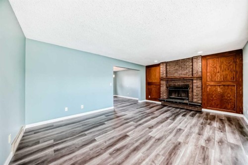 4308 55 Street Ne, Calgary, AB - Indoor Photo Showing Living Room With Fireplace