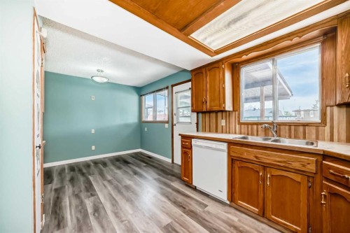 4308 55 Street Ne, Calgary, AB - Indoor Photo Showing Kitchen With Double Sink