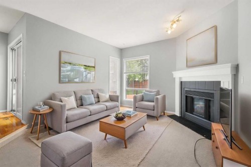 256 Covington Place Ne, Calgary, AB - Indoor Photo Showing Living Room With Fireplace