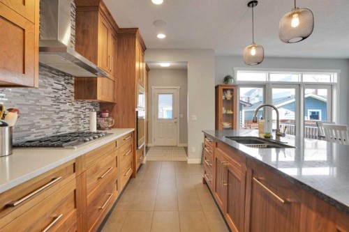 145 Marquis Common Se, Calgary, AB - Indoor Photo Showing Kitchen With Double Sink With Upgraded Kitchen