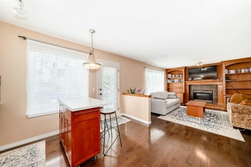 327 Hidden Ranch Circle Nw, Calgary, AB - Indoor Photo Showing Living Room With Fireplace