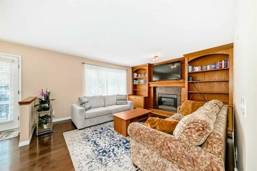 327 Hidden Ranch Circle Nw, Calgary, AB - Indoor Photo Showing Living Room With Fireplace