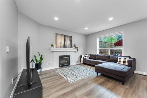 44 Tuscarora Place Nw, Calgary, AB - Indoor Photo Showing Living Room With Fireplace