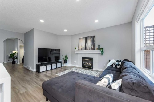44 Tuscarora Place Nw, Calgary, AB - Indoor Photo Showing Living Room With Fireplace