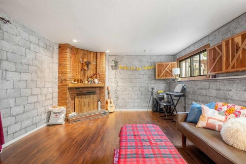 224 Ranchview Place Nw, Calgary, AB - Indoor With Fireplace