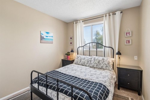 47 Cedargrove Way Sw, Calgary, AB - Indoor Photo Showing Bedroom