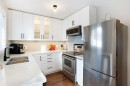 10 Deerfield Green Se, Calgary, AB  - Indoor Photo Showing Kitchen With Double Sink 