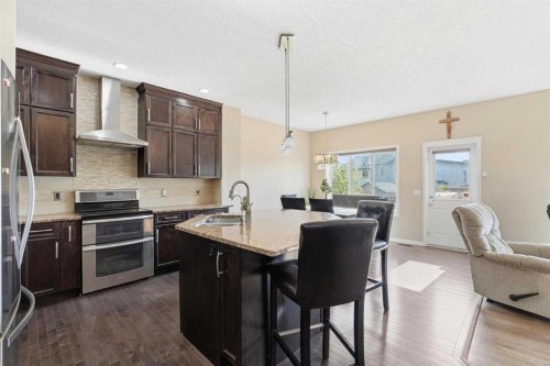 19 Hillcrest Link Sw, Airdrie, AB - Indoor Photo Showing Kitchen With Double Sink With Upgraded Kitchen