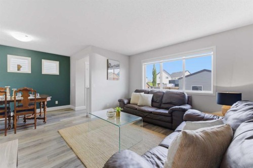 394 Copperpond Boulevard Se, Calgary, AB - Indoor Photo Showing Living Room