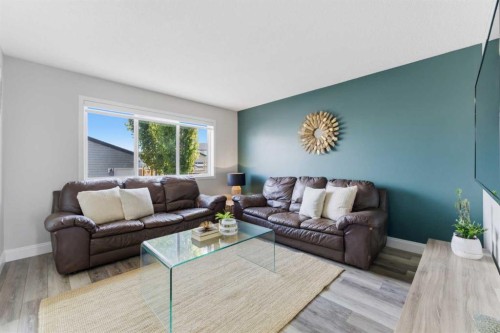 394 Copperpond Boulevard Se, Calgary, AB - Indoor Photo Showing Living Room