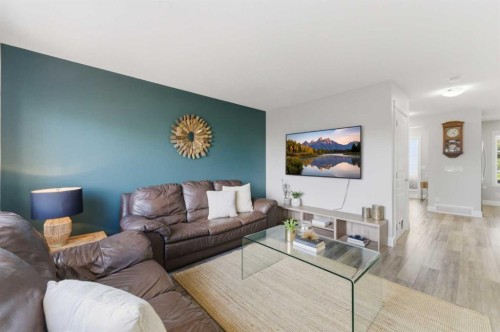 394 Copperpond Boulevard Se, Calgary, AB - Indoor Photo Showing Living Room