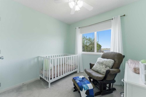 394 Copperpond Boulevard Se, Calgary, AB - Indoor Photo Showing Bedroom