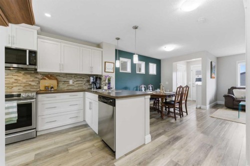 394 Copperpond Boulevard Se, Calgary, AB - Indoor Photo Showing Kitchen With Upgraded Kitchen