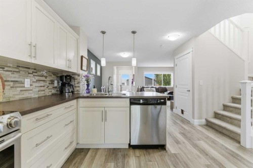 394 Copperpond Boulevard Se, Calgary, AB - Indoor Photo Showing Kitchen With Stainless Steel Kitchen With Double Sink