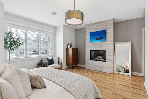 2707 1 Avenue Nw, Calgary, AB - Indoor Photo Showing Bedroom With Fireplace