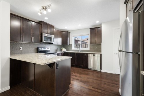 54 Legacy Common Se, Calgary, AB - Indoor Photo Showing Kitchen With Upgraded Kitchen