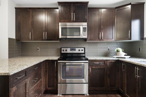 54 Legacy Common Se, Calgary, AB - Indoor Photo Showing Kitchen With Upgraded Kitchen
