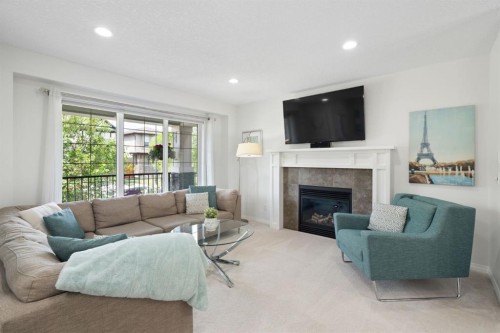 54 Legacy Common Se, Calgary, AB - Indoor Photo Showing Living Room With Fireplace