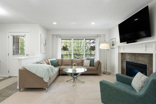 54 Legacy Common Se, Calgary, AB - Indoor Photo Showing Living Room With Fireplace