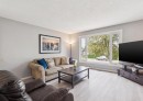 7828 20A Street Se, Calgary, AB  - Indoor Photo Showing Living Room 