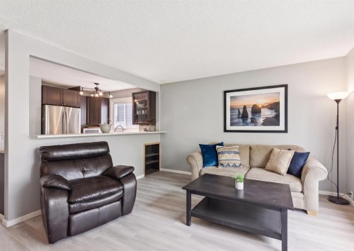 7828 20A Street Se, Calgary, AB - Indoor Photo Showing Living Room