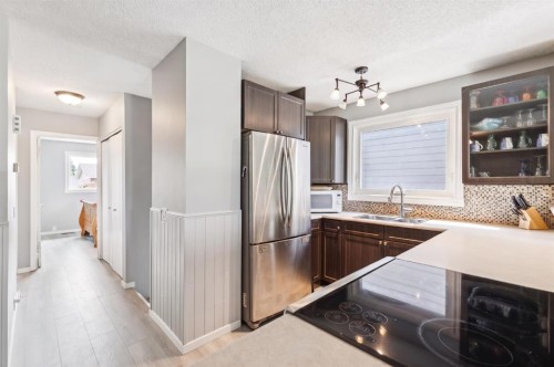 7828 20A Street Se, Calgary, AB - Indoor Photo Showing Kitchen With Double Sink