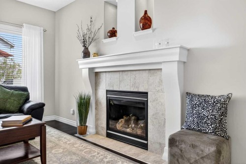 293 Bridleridge View Sw, Calgary, AB - Indoor Photo Showing Living Room With Fireplace