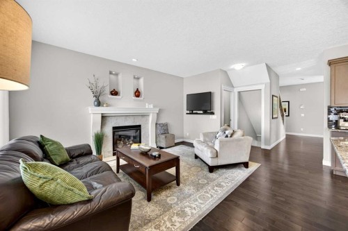 293 Bridleridge View Sw, Calgary, AB - Indoor Photo Showing Living Room With Fireplace