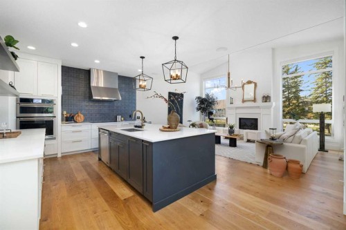 13 Shawnee Heath Sw, Calgary, AB - Indoor Photo Showing Kitchen With Fireplace With Upgraded Kitchen