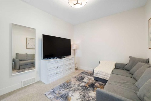 13 Shawnee Heath Sw, Calgary, AB - Indoor Photo Showing Living Room