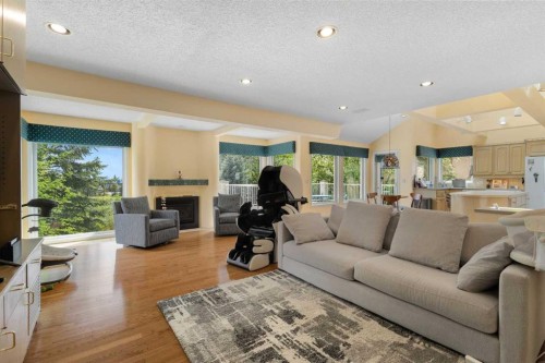 49 Scandia Hill Nw, Calgary, AB - Indoor Photo Showing Living Room With Fireplace