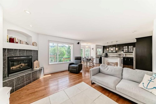 191 Sienna Park Terrace Sw, Calgary, AB - Indoor Photo Showing Living Room With Fireplace