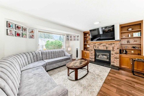 81 Eldorado Close Ne, Calgary, AB - Indoor Photo Showing Living Room With Fireplace