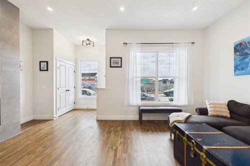 11 Royston Park Nw, Calgary, AB - Indoor Photo Showing Living Room With Fireplace