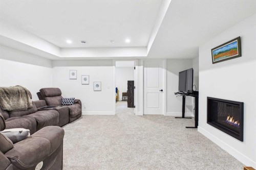 11 Royston Park Nw, Calgary, AB - Indoor With Fireplace