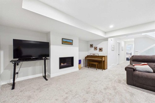 11 Royston Park Nw, Calgary, AB - Indoor With Fireplace