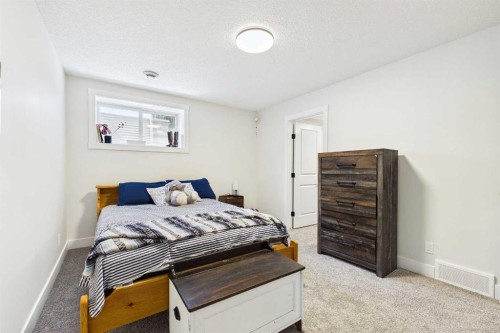 11 Royston Park Nw, Calgary, AB - Indoor Photo Showing Bedroom