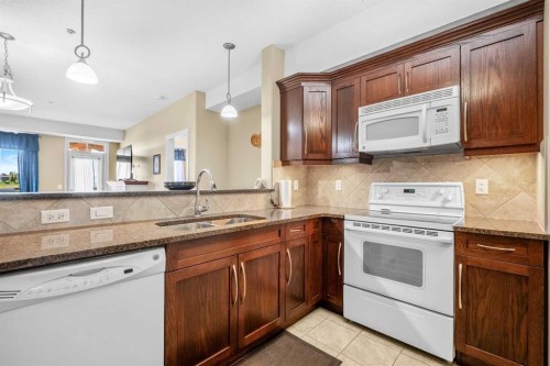 2303-2330 Fish Creek Boulevard Sw, Calgary, AB - Indoor Photo Showing Kitchen With Double Sink