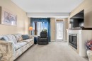 2303-2330 Fish Creek Boulevard Sw, Calgary, AB  - Indoor Photo Showing Living Room With Fireplace 