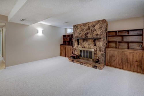 2328 Munro Drive Ne, Calgary, AB - Indoor With Fireplace
