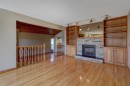 2328 Munro Drive Ne, Calgary, AB  - Indoor Photo Showing Living Room With Fireplace 