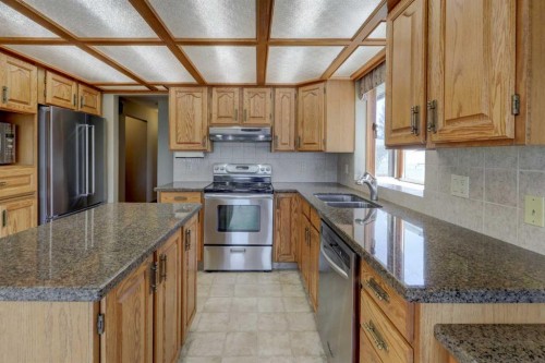 2328 Munro Drive Ne, Calgary, AB - Indoor Photo Showing Kitchen With Stainless Steel Kitchen With Double Sink With Upgraded Kitchen