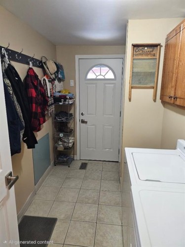 209 2 Street, Cowley, AB - Indoor Photo Showing Laundry Room