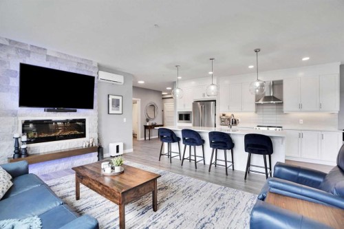 105-55 Wolf Hollow Crescent Se, Calgary, AB - Indoor Photo Showing Living Room With Fireplace