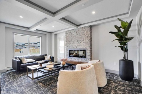 105-55 Wolf Hollow Crescent Se, Calgary, AB - Indoor Photo Showing Living Room With Fireplace